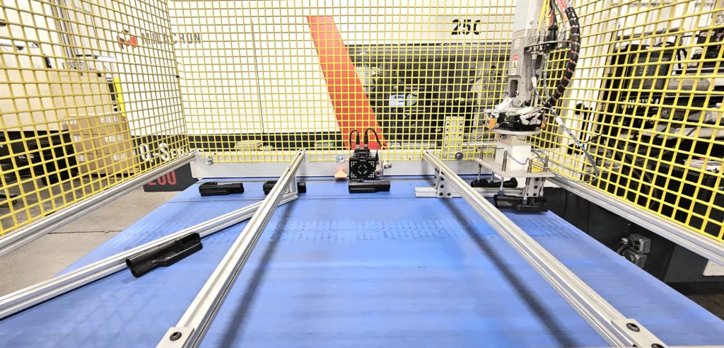 Blue conveyor plane with parts